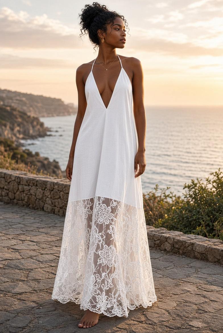 Model wearing the Anela Halter Lace-Hem Maxi Dress on a coastal terrace